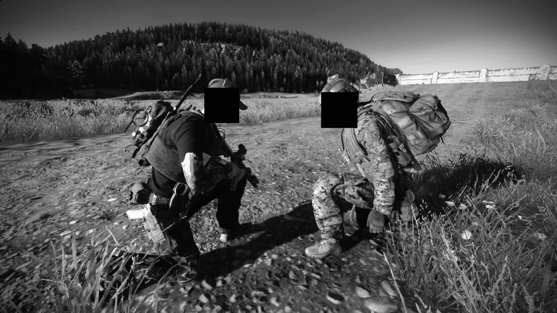 Two team members kneeling during field instruction