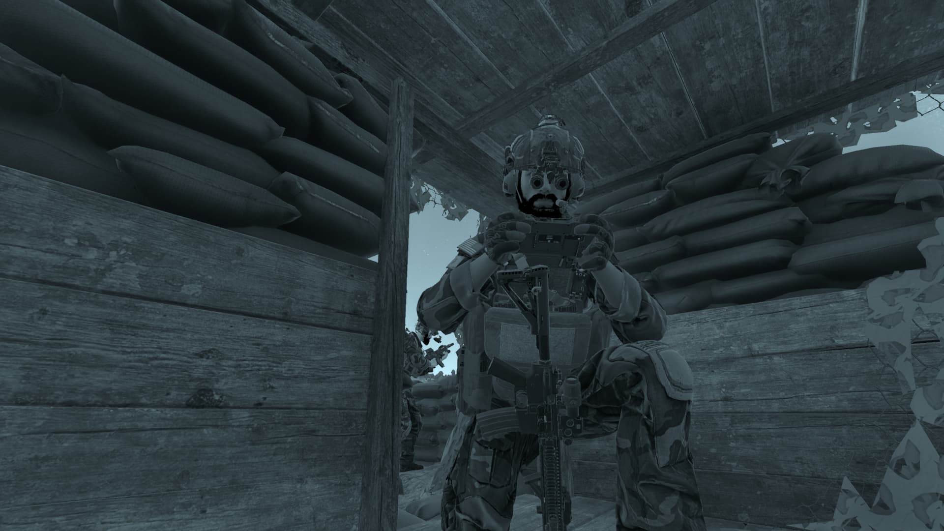Night-vision view of a team member using a handheld device