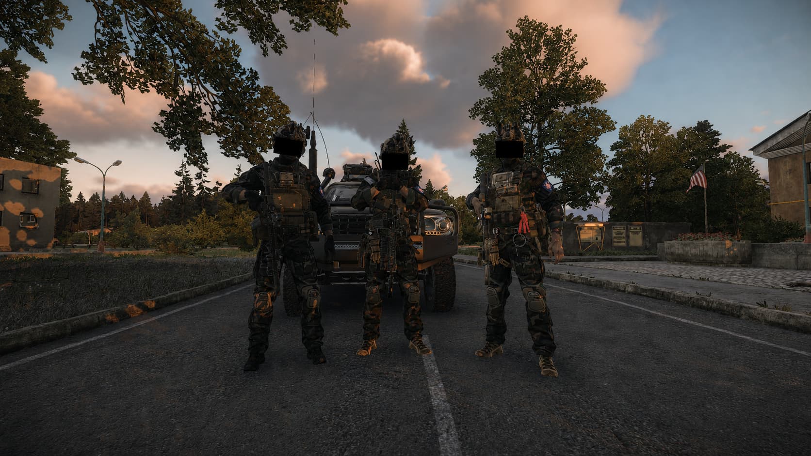 A team beside its ground vehicle at dusk
